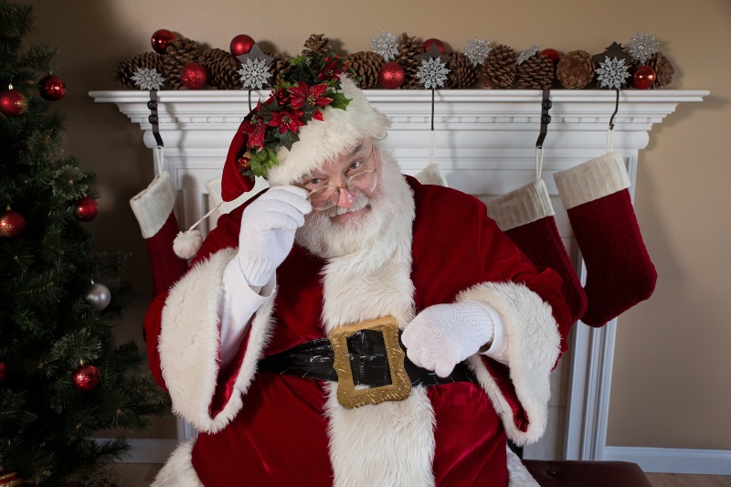 father christmas by a fireplace